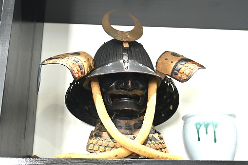 Japan tourism, Japanese history and culture. Old Japanese combat uniform 'Yoroi' and 'Kabuto'. Japanese Armor and Samurai Warrior helmet.