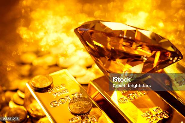 Amber Diamond On Gold Bars Stock Photo - Download Image Now - Diamond - Gemstone, Gold - Metal, Gold Colored