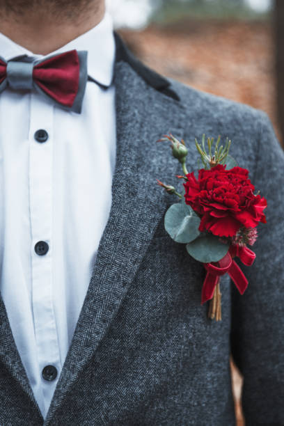 istock Groom with a bowtie and flower 1636635725