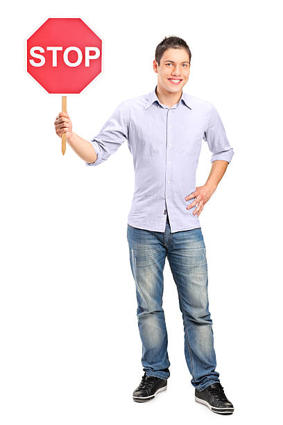 istock Mman holding a traffic sign stop 163667163