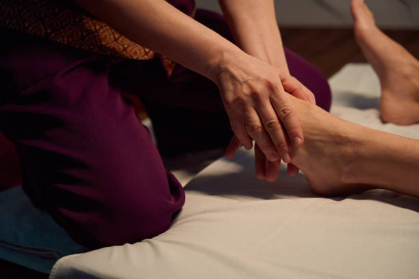istock Qualified masseuse giving traditional Thai feet massage to her client 1636672514