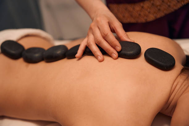 istock Experienced masseuse relieving client of dorsal pain 1636674203