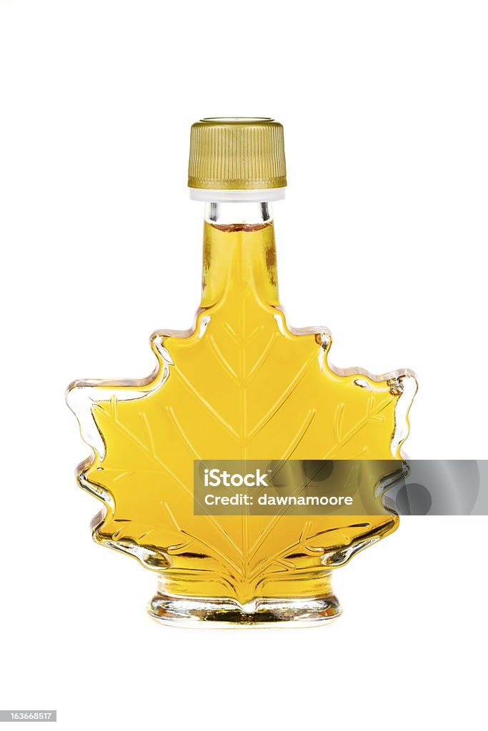 Maple Syrup Maple syrup bottle isolated on a white background. Maple Syrup Stock Photo