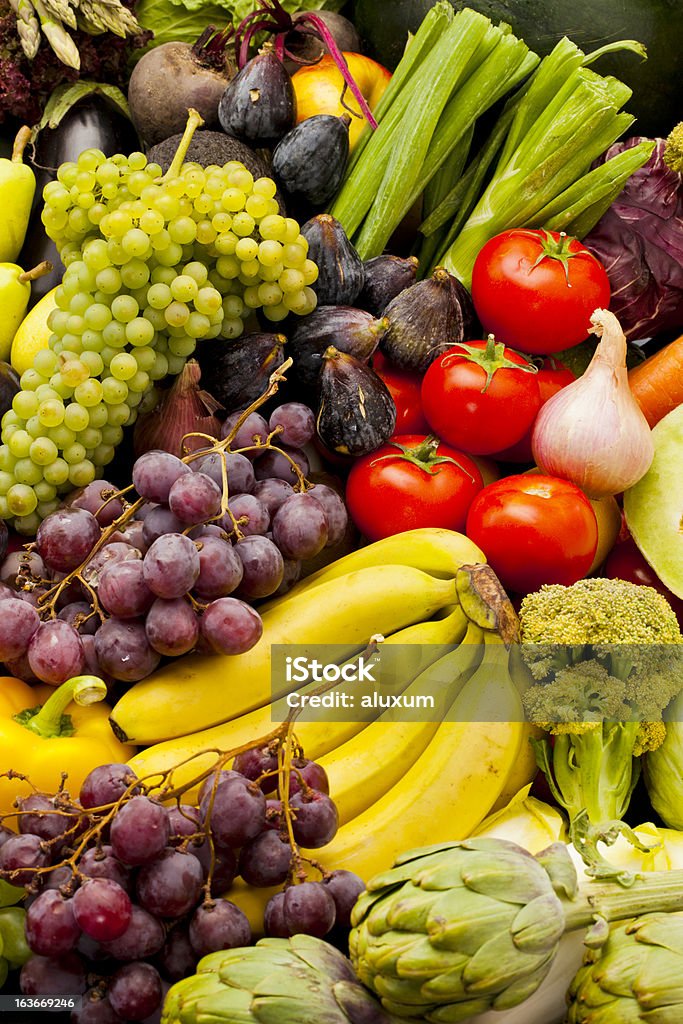 Vegetables and fruits Heap with assortment of fruits and vegetables Abundance Stock Photo