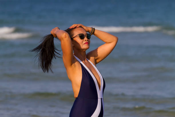 istock Woman body beautiful with bikini relax on beach 1636693783