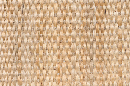The texture of a jute brown fabric with a large interlacing of fibers