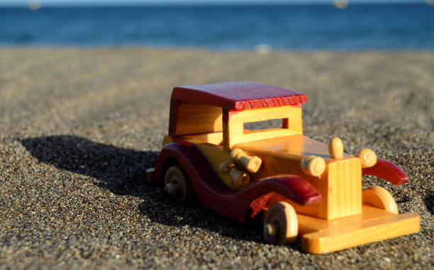 istock Toy Car on the Seashore 1636737660