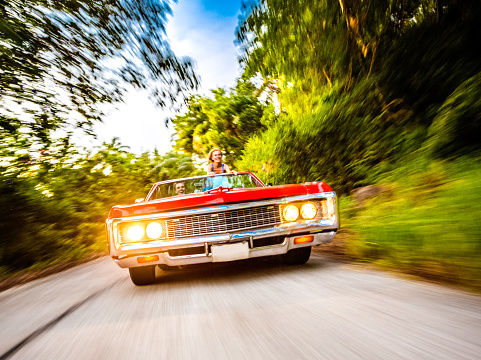 Romantic couple driving car on vacation