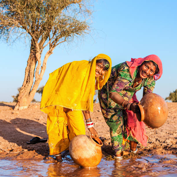 istock Indian women collecting water, Rajasthan 163673911