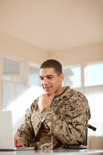 istock Disabled Veteran US Marine in Wheelchair 163674199