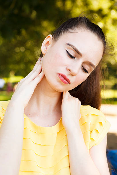 istock Woman Massaging Her Neck 163674334