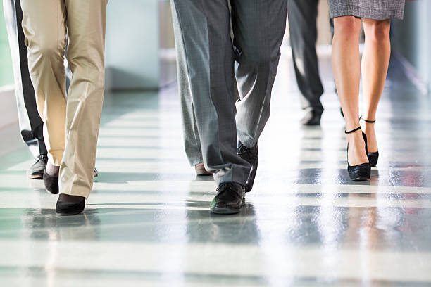 istock Group of business people walking on corridor. 163674431