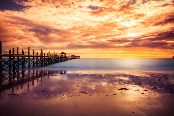 istock Tropical Sunset on the Ocean and Pier 163674584