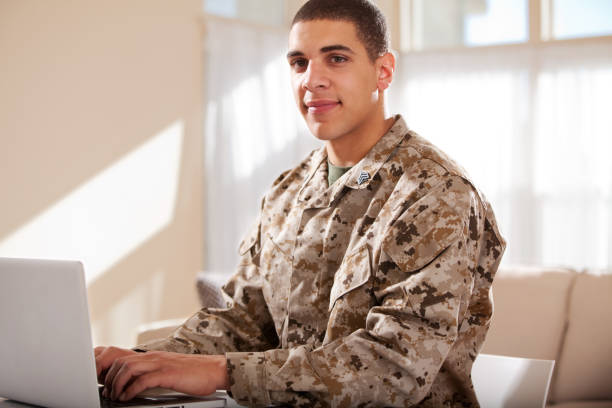 istock US Marine studyng at home on a laptop 163674686