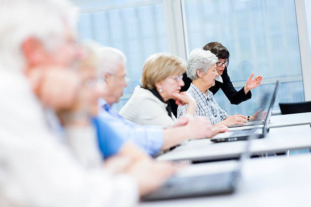 istock Female Teacher Explaining New Computer Technology to Senior Woman 163675805