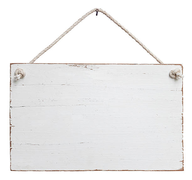 Old, white weathered signboard hanging by a string Rectangular wooden signboard painted in white and featuring an old, weathered look. The wooden board features light brown edges and hangs by an off-white rope from a nail set at the top-center of the image. This composite image is isolated on a white background and includes a clipping path. hanging signboard stock pictures, royalty-free photos & images