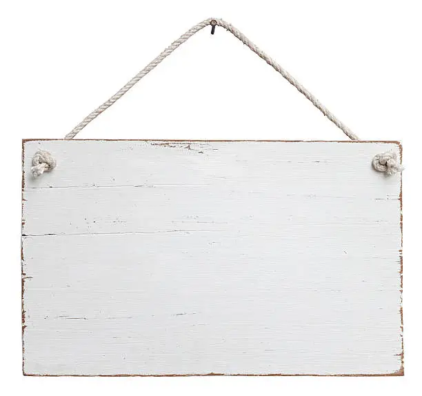 Rectangular wooden signboard painted in white and featuring an old, weathered look.  The wooden board features light brown edges and hangs by an off-white rope from a nail set at the top-center of the image.  This composite image is isolated on a white background and includes a clipping path.