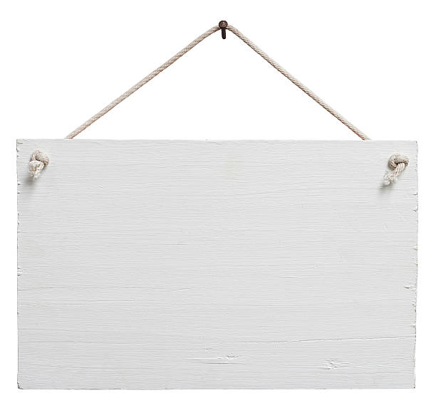 Old weathered white wood signboard. Old weathered white painted wood signboard, hanging by old rope from a nail, composite image, isolated on white, clipping path included. hanging stock pictures, royalty-free photos & images