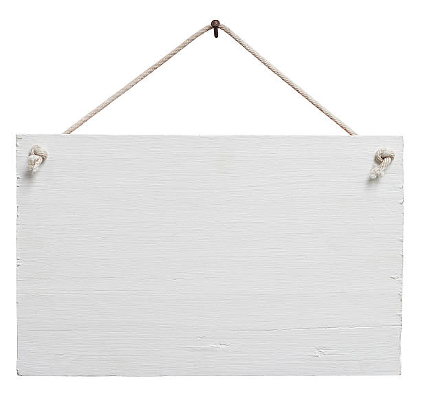 Old weathered white wood signboard. Old weathered white painted wood signboard, hanging by old rope from a nail, composite image, isolated on white, clipping path included. hanging signboard stock pictures, royalty-free photos & images