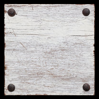 White grunge wood board with four old bolts. Isolated on black, clipping path included, composite image.