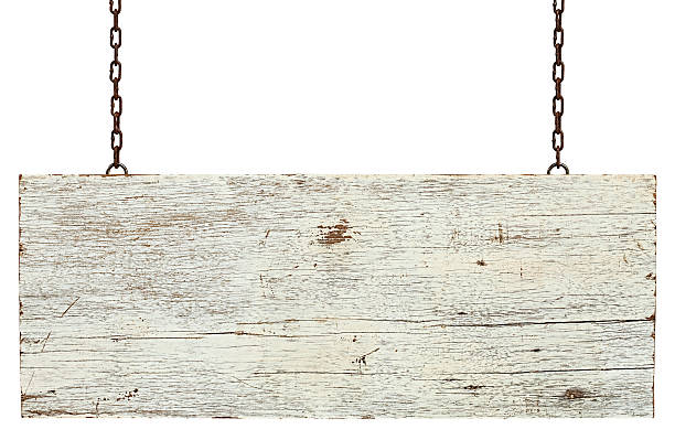 Old weathered white wood signboard. Old weathered white wood signboard, hanging by old chains, composite image, isolated on white, clipping path included. rusted chain stock pictures, royalty-free photos & images