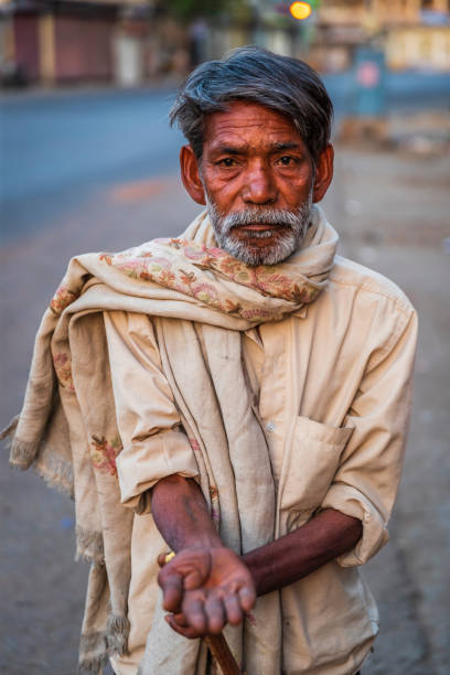 istock Homeless man standing on a street and asking for help 1636764710