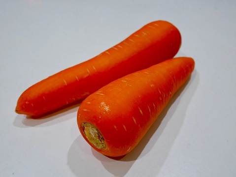 Close-up of organic carrots at outdoor farmer's market.