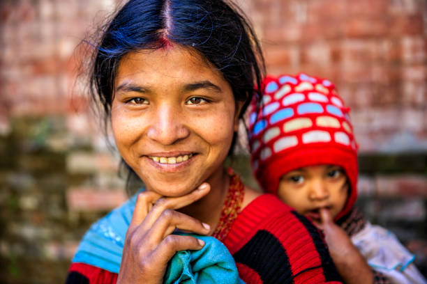 istock Young mother carrying her baby, Kathmandu, Nepal 1636765230