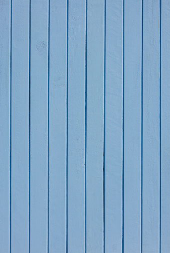Old painted blue wooden board background.