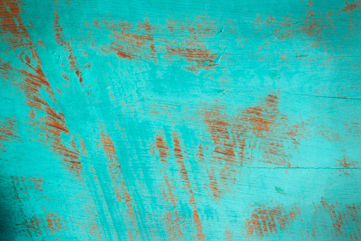 Old painted wooden turquoise board background.