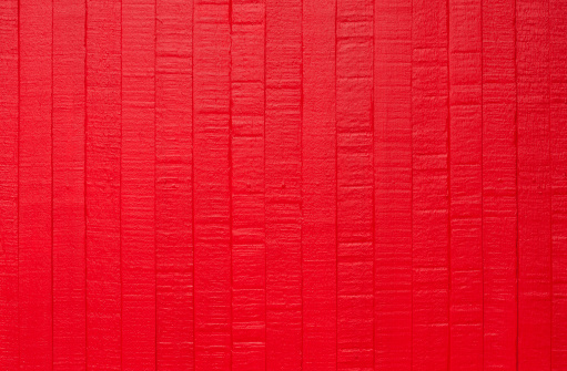 red wood wall, background. painted old red wooden wall. red background.