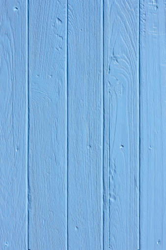 Old painted blue wooden board background.
