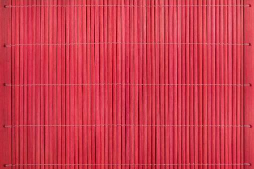 Red bamboo slatted background.