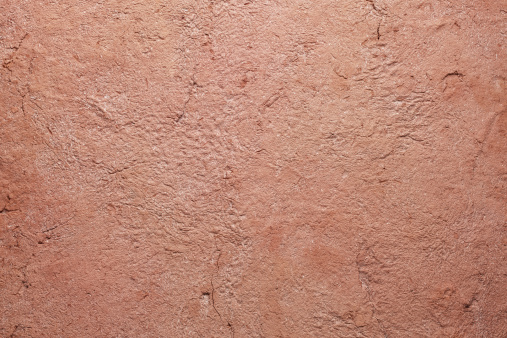 Terracotta background.