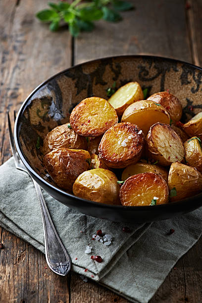 istock Oven-baked potatoes with sea salt and herbs 163677054