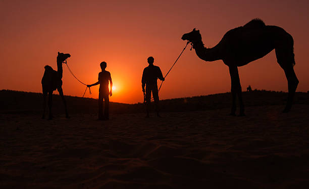 istock Silhouette of Camel Riders at Pushkar 163677480