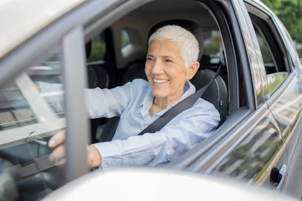 istock Woman is driving a car on her way to work 1636793362