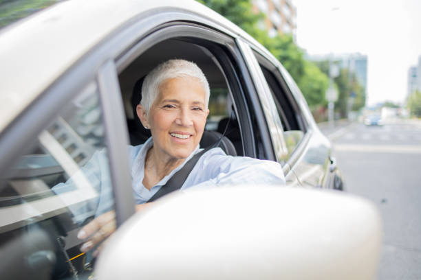 istock Woman is driving a car on her way to work 1636793366
