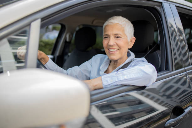 istock Woman is driving a car on her way to work 1636793369