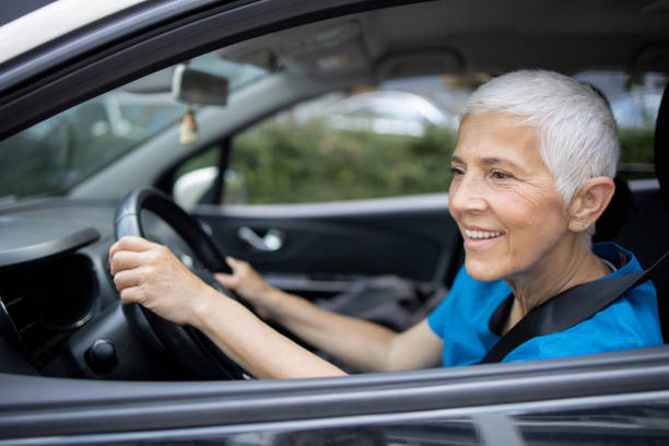 istock Woman is driving a car on her way to work 1636793381