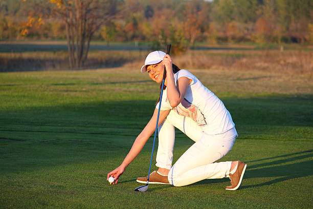 istock beautiful girl golf player on field 163679843