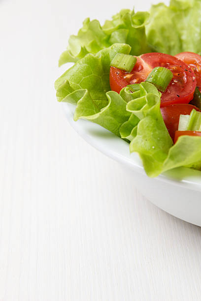 istock fresh light salad with cherry tomatoes and chives 163680014