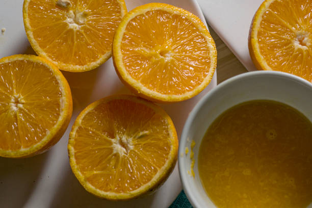 istock Orange fruit and orange juice on a cup 1636857086
