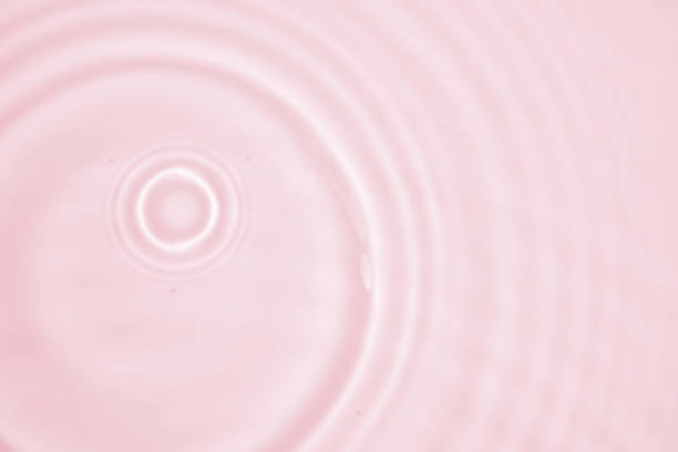 Abstract transparent water shadow surface texture natural ripple on pink background