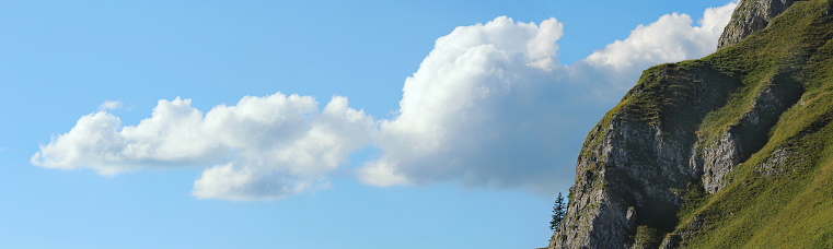 closeup of a cloud near a mountain slope