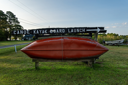 Piney Point, Maryland, USA  A canoe is used on a sign to promote a launch for conoes, kayaks and boards.
