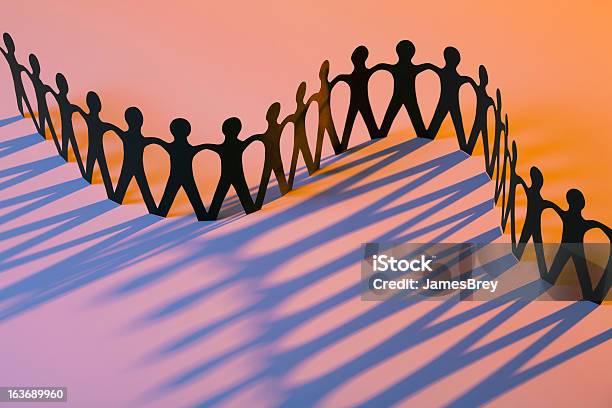 Paper Men Joining Together As Team Union Family Or Network Stock Photo - Download Image Now