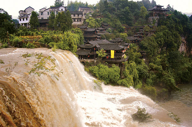 istock Waterfall and China traditional houses 163692719