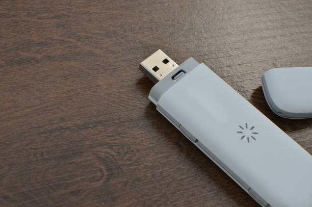 istock Latest generation USB 5G modem close for internet connection, allowing fast, efficient and modern connection. 5G chip technology ensuring mobile speed and stability. 1636935213