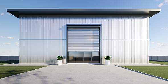 3d rendering of exterior of commercial building design. May called modern factory, warehouse, shop or store. Include metal door or roller shutter, space on concrete floor for industrial background.